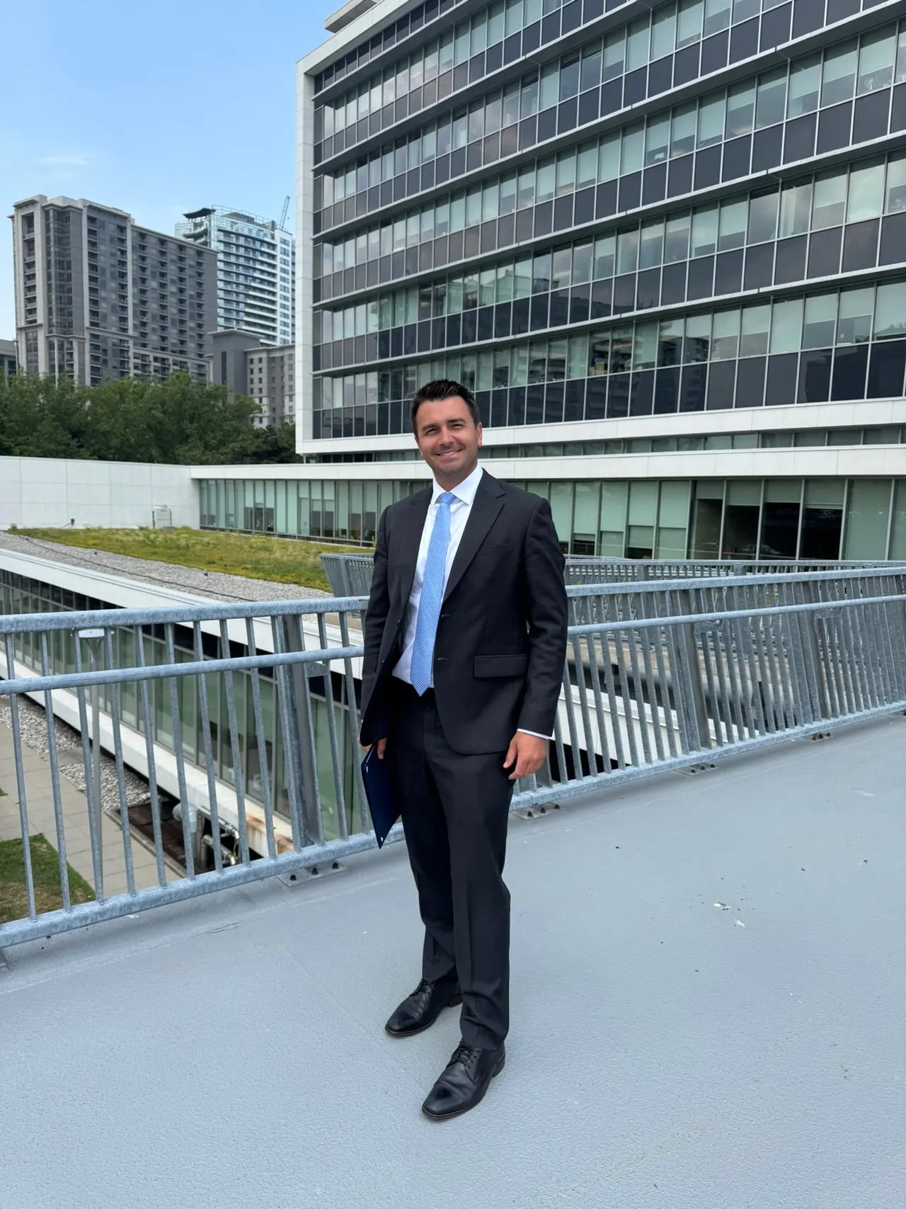 Matt Francis on a city pedestrian bridge