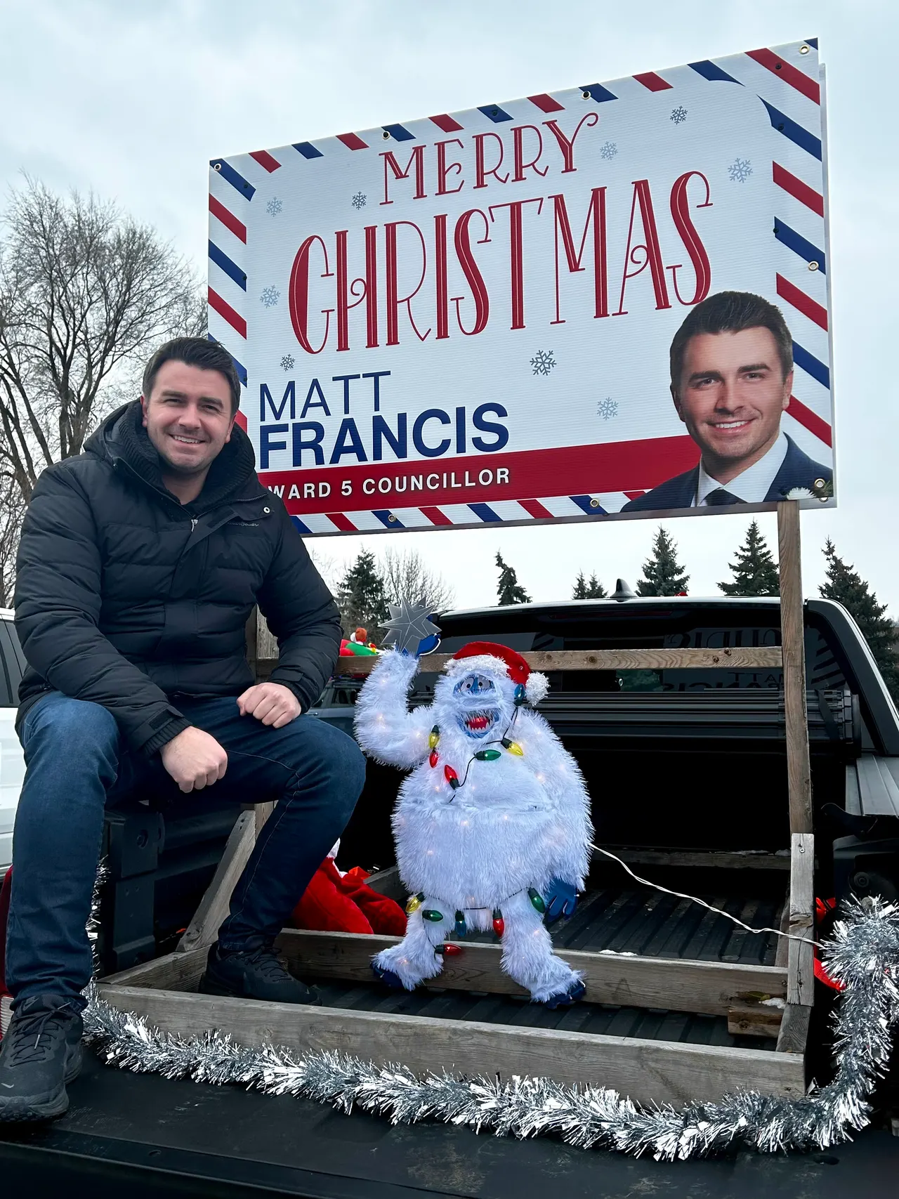 Matt Francis on a Merry Christmas float in the Santa Claus Parade