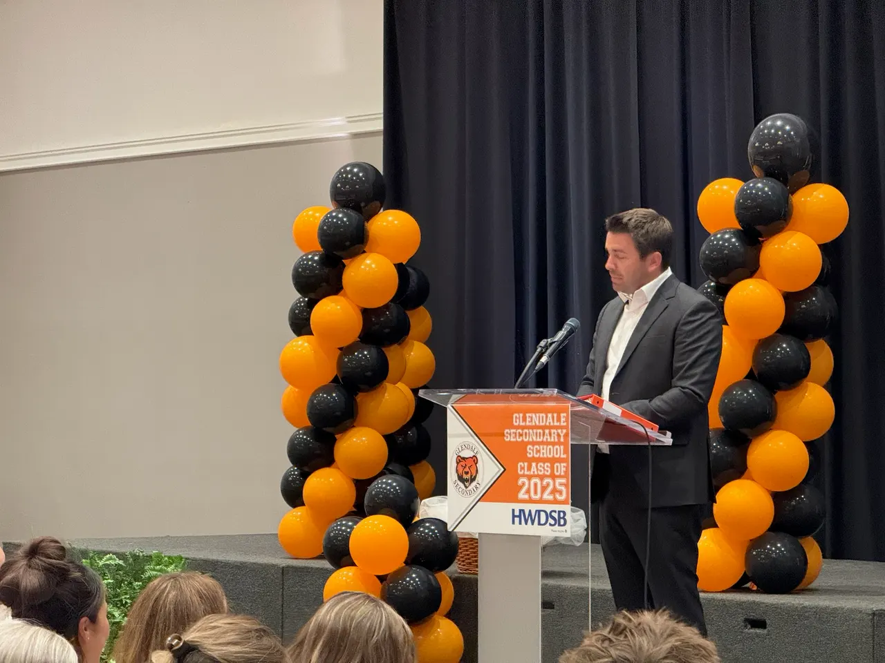 Matt Francis speaking at a secondary school graduation ceremony