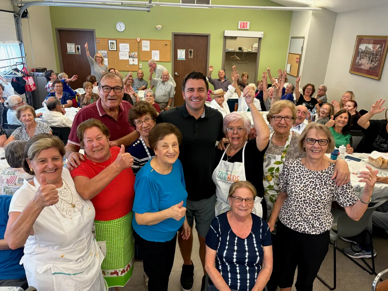 Volunteers and guests gathered at a seniors' community lunch